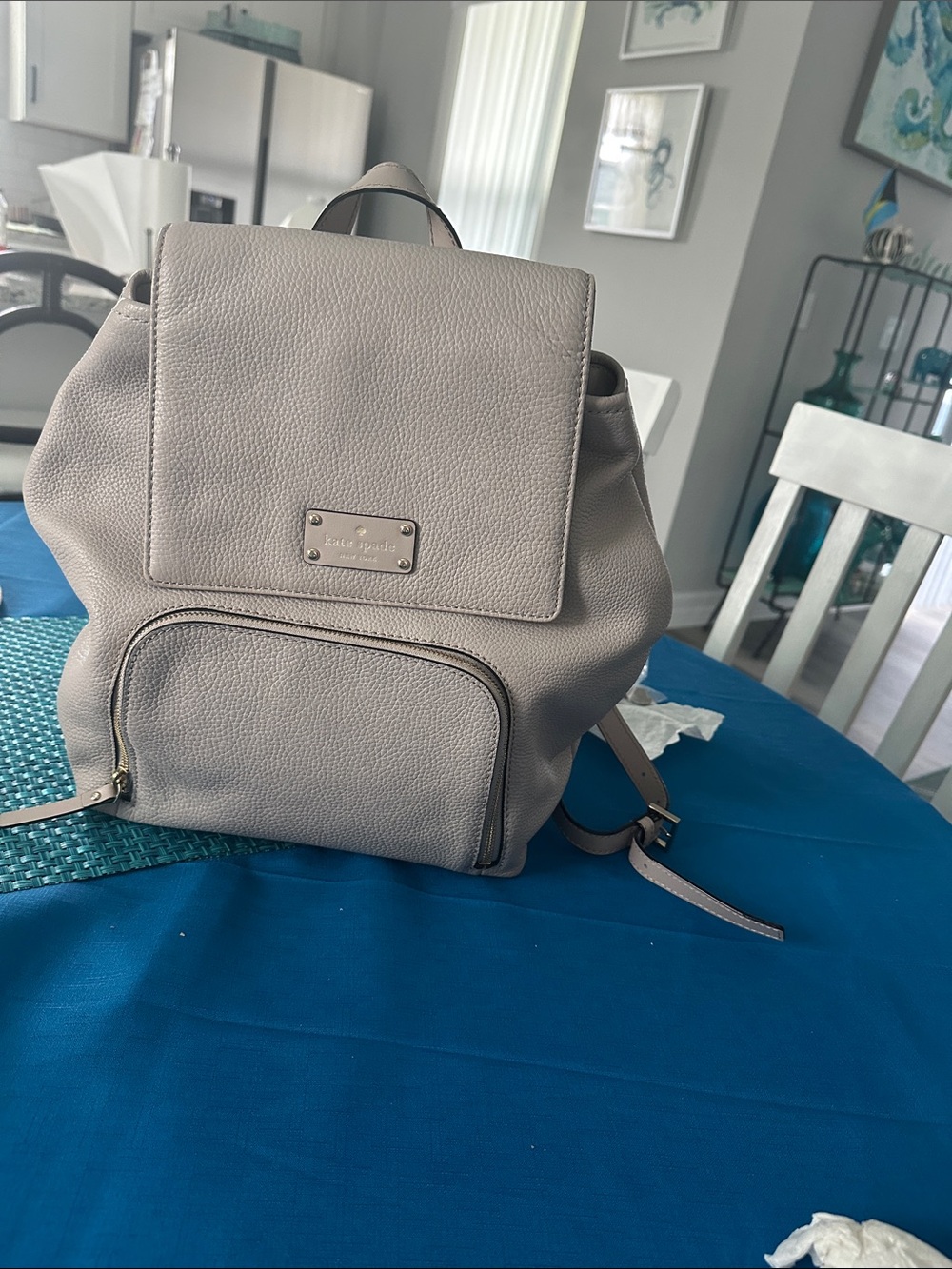 kate spade leather backpack in light gray/ beige / taupe color. A few marks .